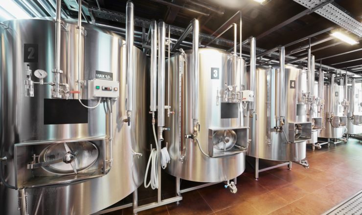 Row of tanks in microbrewery